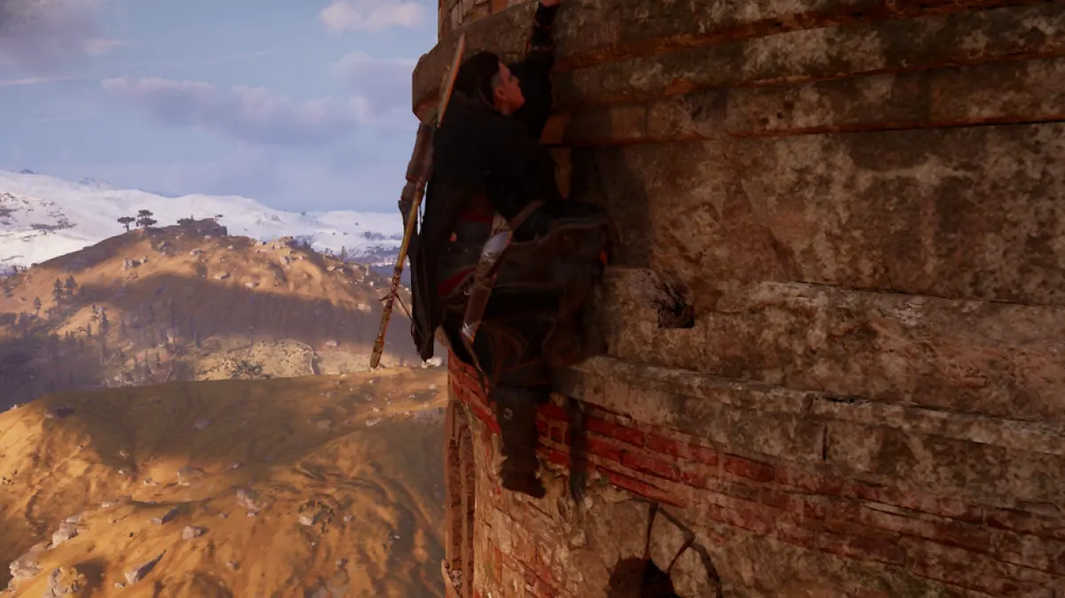 Eivor climbing the side of a stone tower in Assassin's Creed Valhalla.